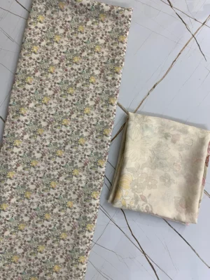 Cream base Dense yellow, purple, green florals